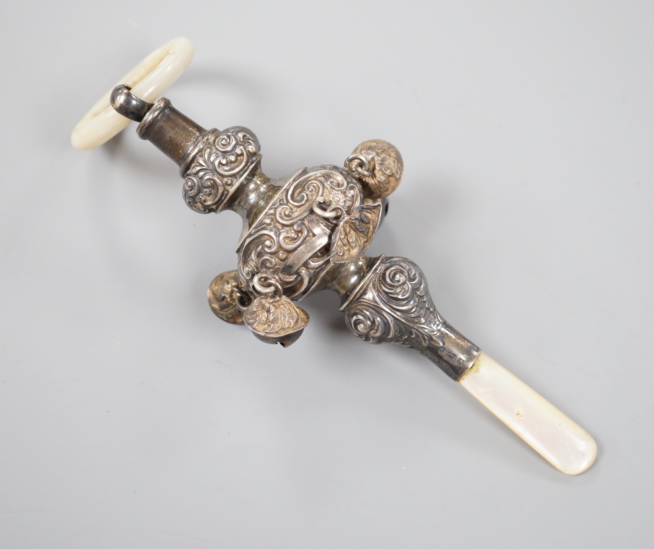 An Edwardian silver and mother of pearl mounted child's rattle, Birmingham, 1904, 16.2cm.